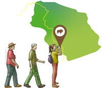 Three people, two walking and one watching with map in background